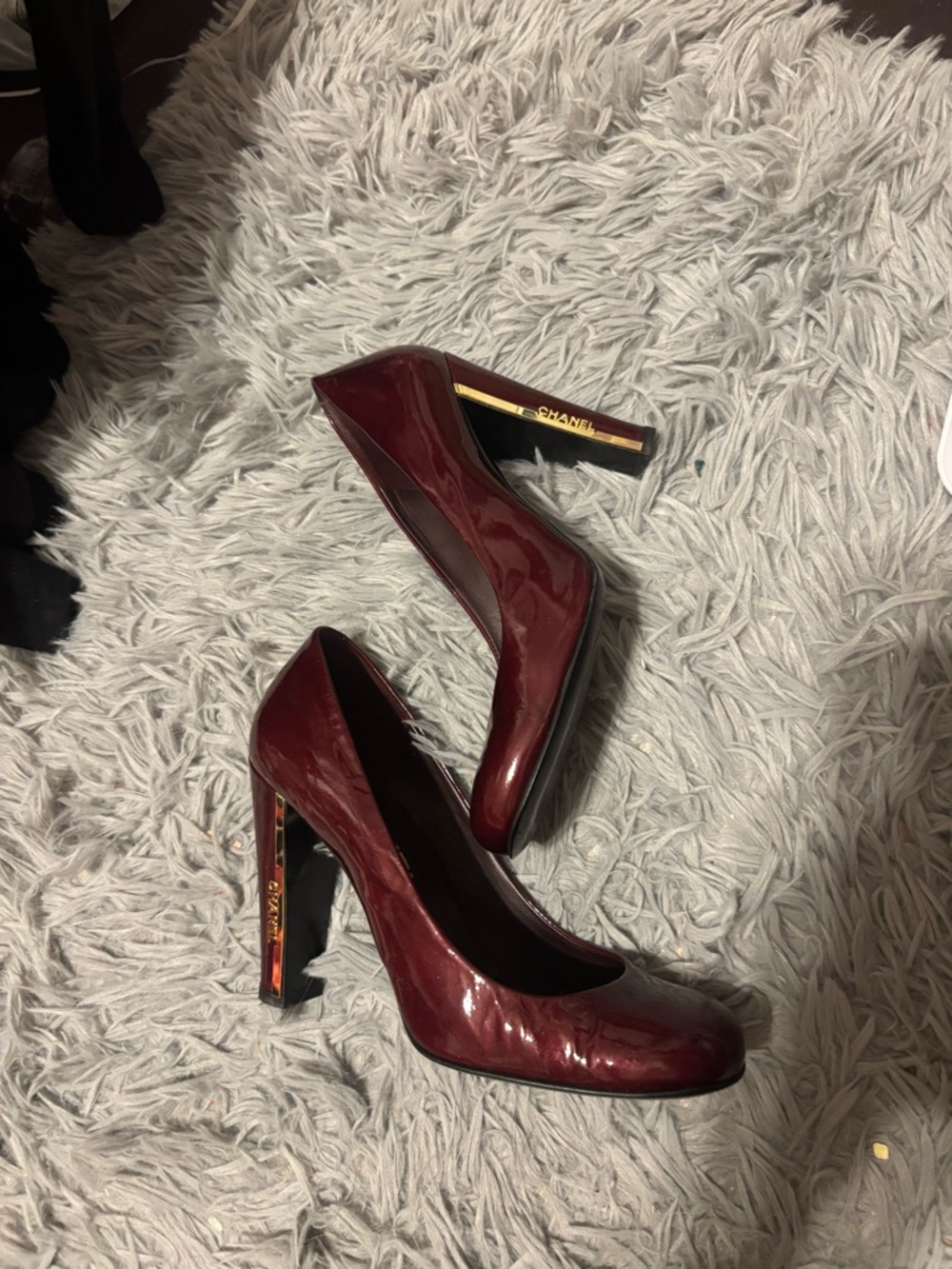 CHANEL Burgundy Patent Leather Pumps with Gold Heel Accent